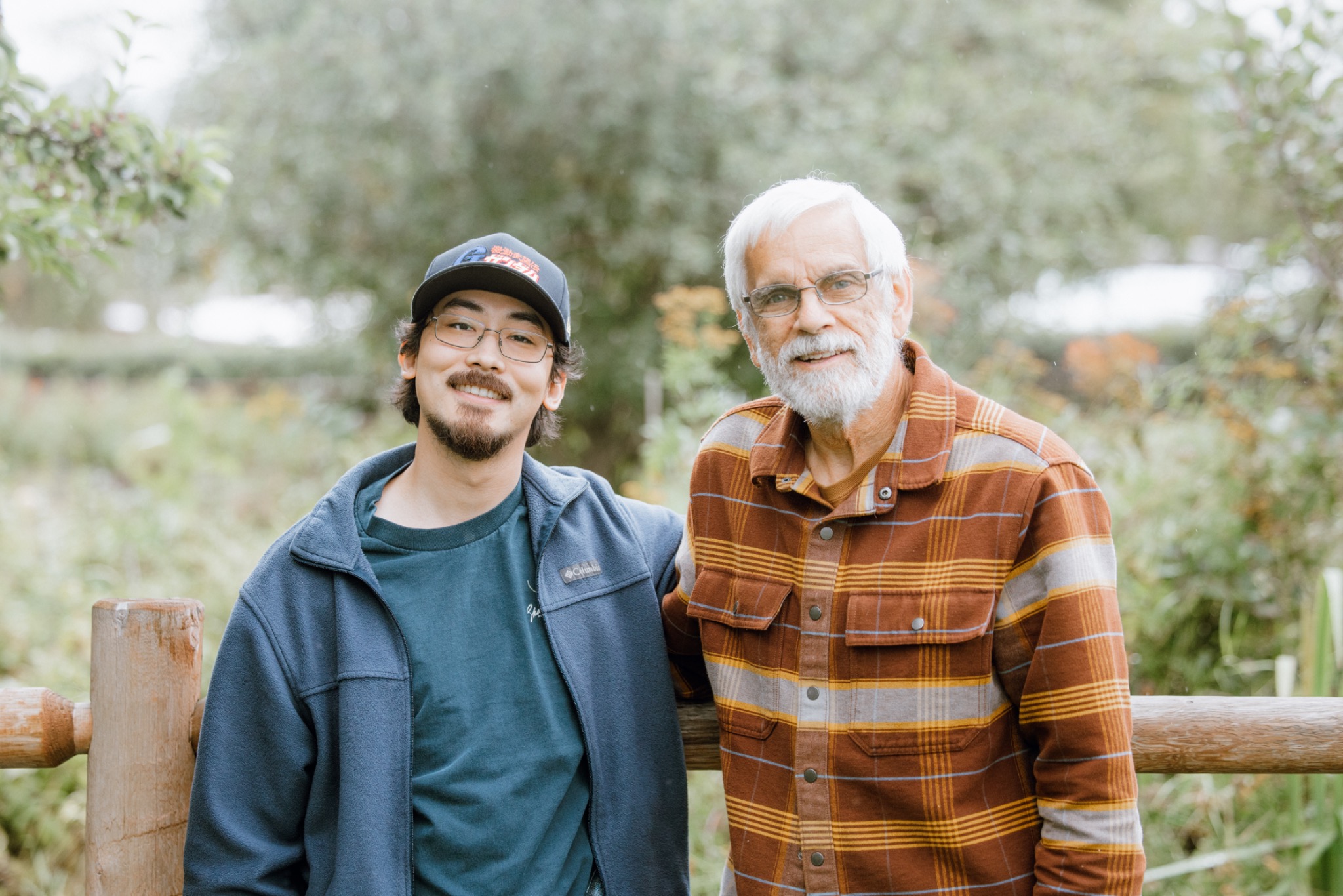 An Alaska Bible College student standing with his mentor outdoors